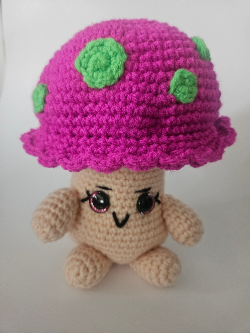 Product Description: Materials used: Yarn, Polyfil, Safety Eyes</br></br>Dimensions: approximately 4w x 10h x 4d inches</br>Cute amigurumi character. Unique gift for family and pets. Available in mushroom man, hanging strawberry and Yeti.</br></br>Artist Statement: Crochet is one of my favorite mediums for artistic expression, where yarn and a hook become the tools through which I craft whimsical characters and imaginative worlds. With each stitch, life is given to these soft sculptures, transforming simple materials into endearing creatures. My work in Amigurumi crochet is a testament to the power of handmade artistry, as each piece has their own unique personality and charm. Through this craft, I seek a sense of wonder, joy, and nostalgia in those who encounter my creations, inviting them to embrace the magic of the handmade and the infinite possibilities of yarn.</br></br>Bio: Casey Lucas is a versatile artist with a background in both dance and visual arts. She earned her Bachelor of Fine Arts (BFA) in Dance from Mason Gross School of the Arts and a Master of Fine Arts (MFA) in Art - Ceramics from Kean University. Casey's artistic journey spans various creative mediums, including Amigurumi crochet and ceramics, through which she brings her unique vision to life. After living in New York City for over a decade, she currently resides in the picturesque town of Princeton, New Jersey. Casey shares her life with her husband and two children, drawing inspiration from the town's historic charm. Her work beautifully combines the tactile and visual arts, creating a seamless fusion of movement, texture, and form. Whether through the fluidity of dance or the intricacies of crochet and ceramics, Casey's artistry is a testament to her unwavering commitment to the creative process. Beyond her artistic pursuits, Casey is a recent breast cancer survivor, showcasing incredible resilience and strength throughout her personal journey. She has chosen to use her art as a force for good, dedicating a portion of her sales to support cancer research. Her work not only embodies creativity and passion but also carries a profound message of hope and determination.</br></br>$28 *</br>Price subject to sales tax.</br></br>Item Number: CL59</br> Amigurumi Forest in Your Home by Casey Lucas